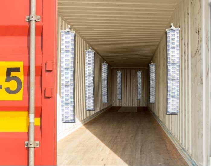 Inside view of a shipping container with multiple Best Dry container desiccant strips properly installed on the walls to prevent moisture during shipment.
